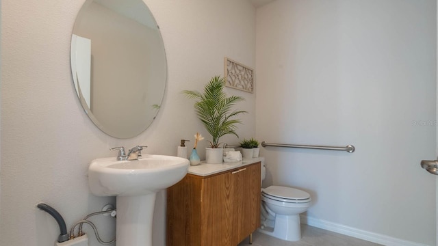 half bath featuring tile patterned flooring, baseboards, and toilet