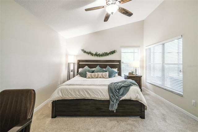 bedroom with vaulted ceiling, baseboards, and carpet floors