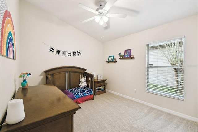 bedroom with baseboards, light carpet, and a ceiling fan