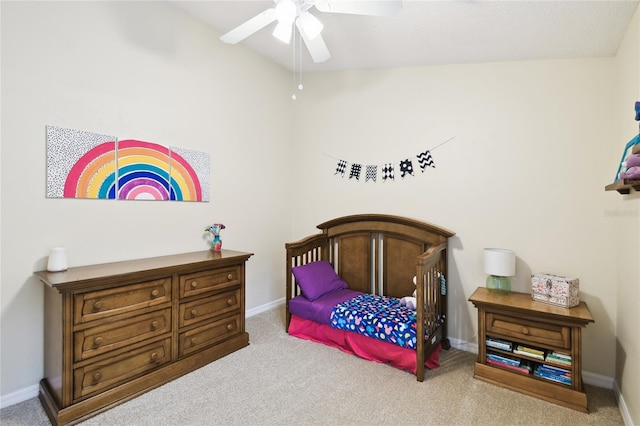 bedroom featuring carpet and baseboards