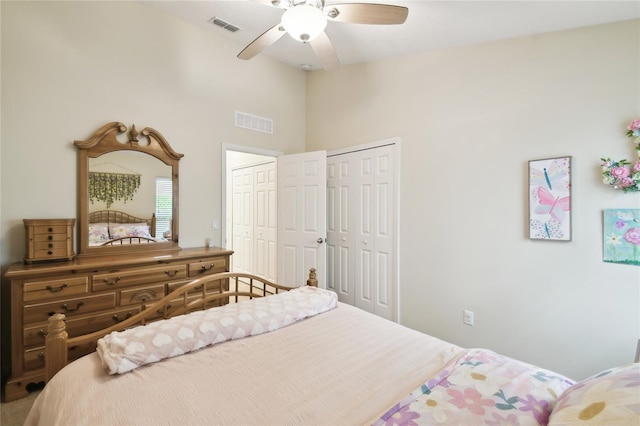 bedroom featuring visible vents, lofted ceiling, and a ceiling fan