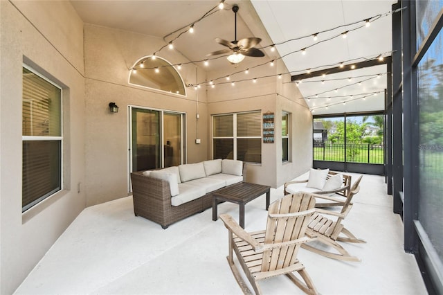 sunroom with rail lighting and ceiling fan