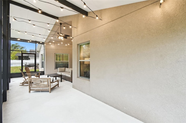 view of patio / terrace with outdoor lounge area and fence