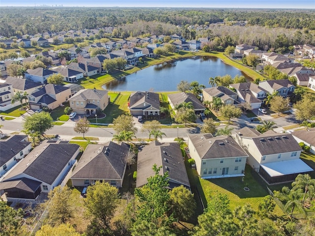 bird's eye view featuring a residential view and a water view