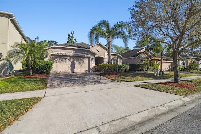 view of front facade featuring stucco siding, a front lawn, decorative driveway, and a garage