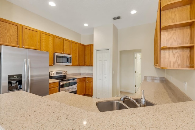1187 Tadsworth Ter, Lake Mary, FL 32746 - kitchen featuring light stone counters, visible vents, open shelves, appliances with stainless steel finishes, and brown cabinets