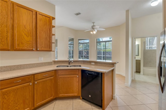 1187 Tadsworth Ter, Lake Mary, FL 32746 - kitchen featuring visible vents, black dishwasher, light tile patterned floors, stainless steel fridge, and a sink
