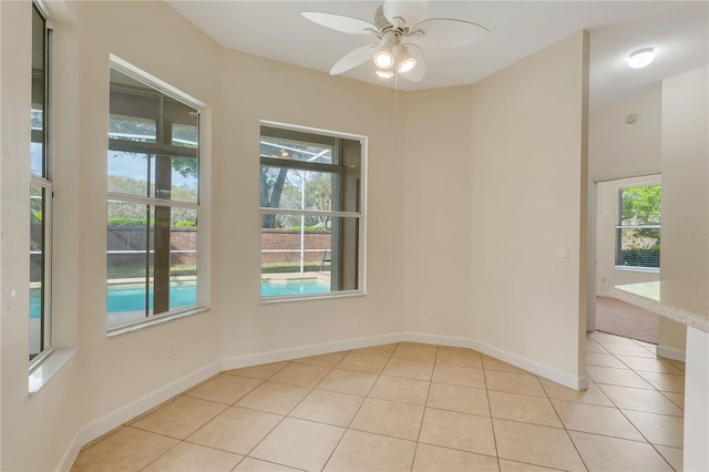 1187 Tadsworth Ter, Lake Mary, FL 32746 - spare room with light tile patterned floors, a ceiling fan, and baseboards