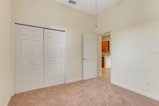 1187 Tadsworth Ter, Lake Mary, FL 32746 - unfurnished bedroom featuring visible vents, baseboards, light colored carpet, and a closet