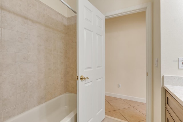 1187 Tadsworth Ter, Lake Mary, FL 32746 - bathroom featuring tile patterned flooring, vanity, baseboards, and bathtub / shower combination