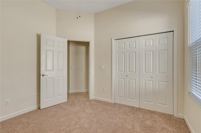 1187 Tadsworth Ter, Lake Mary, FL 32746 - unfurnished bedroom featuring a closet, light carpet, and baseboards