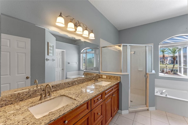 bathroom with a sink, a healthy amount of sunlight, and tile patterned flooring