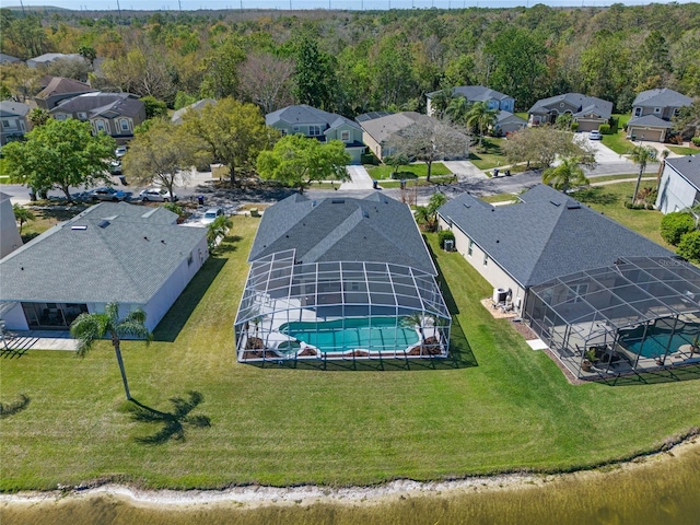 birds eye view of property with a forest view and a residential view