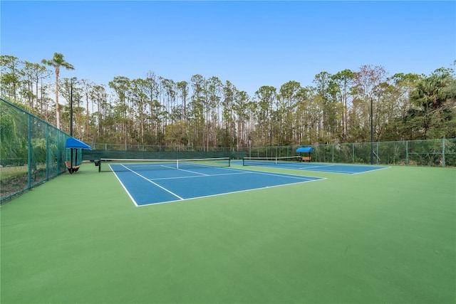 view of sport court with fence