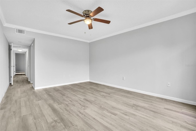 unfurnished room with baseboards, a ceiling fan, crown molding, and light wood finished floors