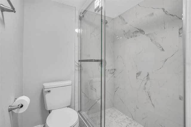 bathroom with a marble finish shower and toilet