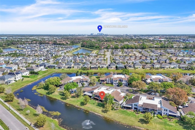 drone / aerial view featuring a residential view and a water view