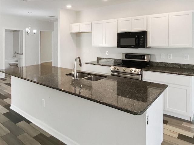 kitchen with a sink, white cabinetry, light wood-style floors, black microwave, and stainless steel electric range oven