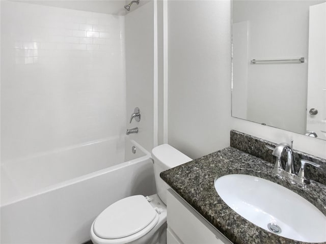 full bathroom with toilet, vanity, and  shower combination