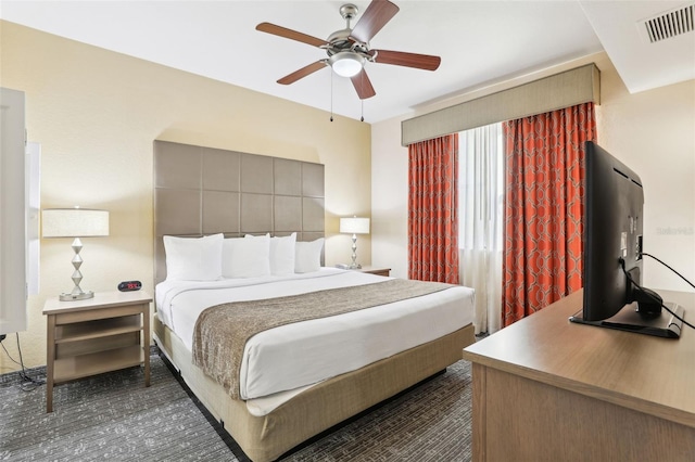 bedroom with visible vents and a ceiling fan