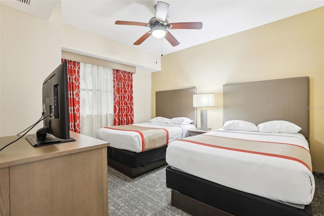 bedroom featuring a ceiling fan and visible vents