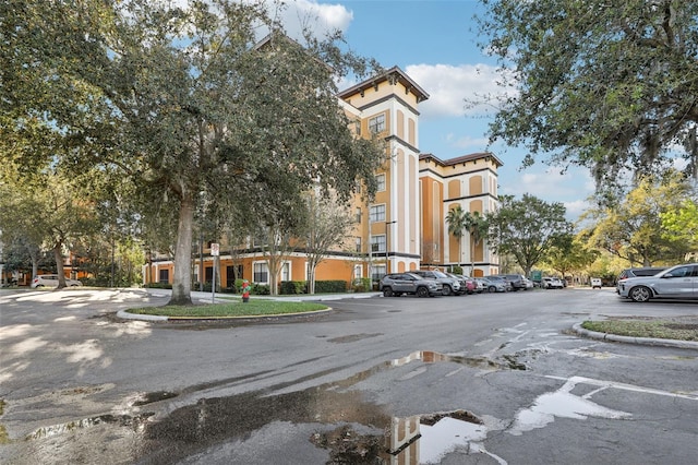 view of property with uncovered parking