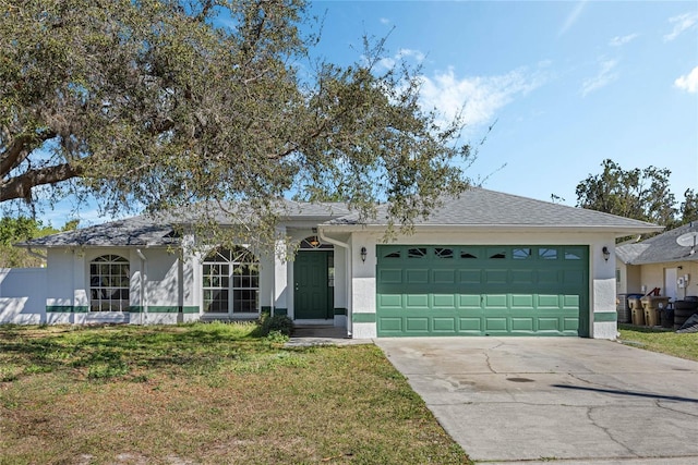 single story home featuring a shingled roof, a front lawn, stucco siding, driveway, and an attached garage