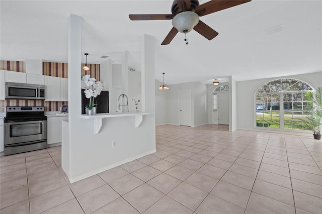 kitchen featuring visible vents, white cabinetry, appliances with stainless steel finishes, light tile patterned flooring, and light countertops