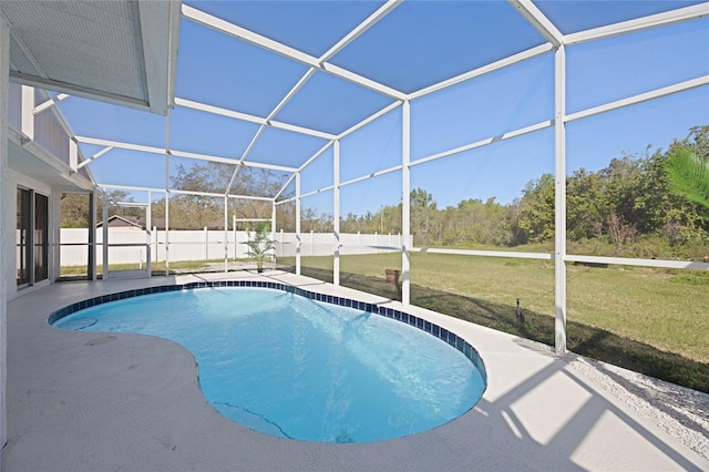 view of pool featuring a patio, a yard, a fenced backyard, and a lanai