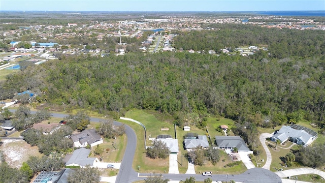 aerial view with a residential view and a wooded view