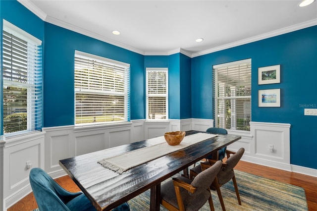 dining area with recessed lighting, wood finished floors, and ornamental molding