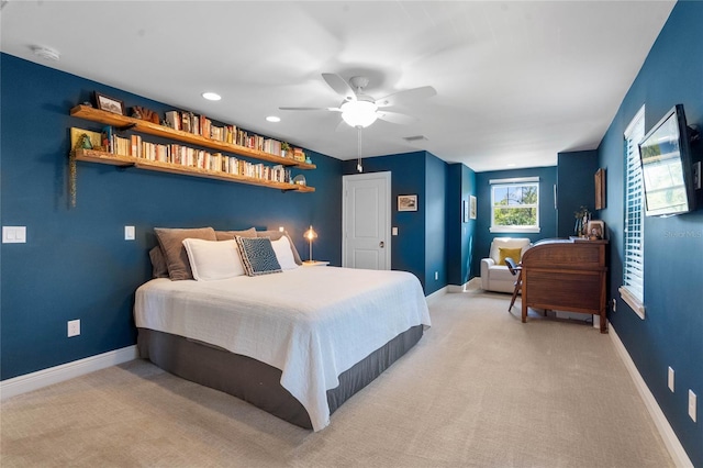 bedroom featuring light carpet, visible vents, and baseboards