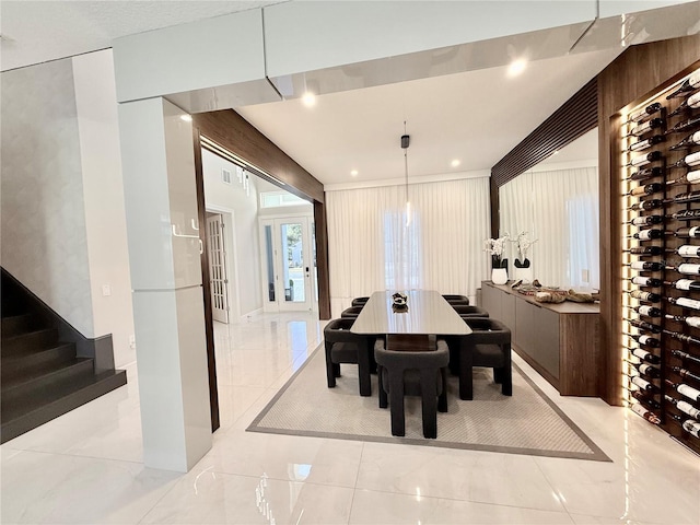 dining room featuring recessed lighting, marble finish floor, and stairs