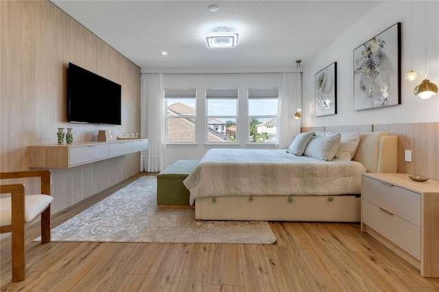 bedroom featuring light wood-style flooring