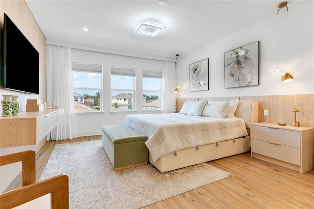 bedroom featuring visible vents and light wood-type flooring