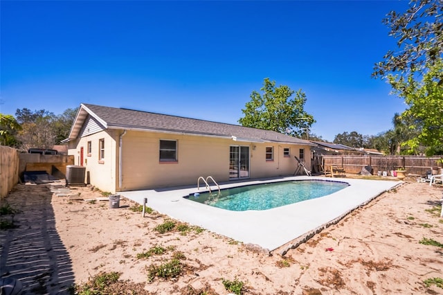 view of pool with a patio, central air condition unit, a fenced backyard, and a fenced in pool