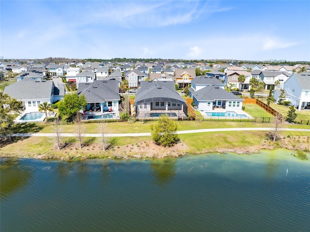 birds eye view of property featuring a residential view and a water view