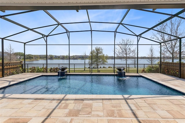 view of pool with a fenced in pool, a patio area, and a water view