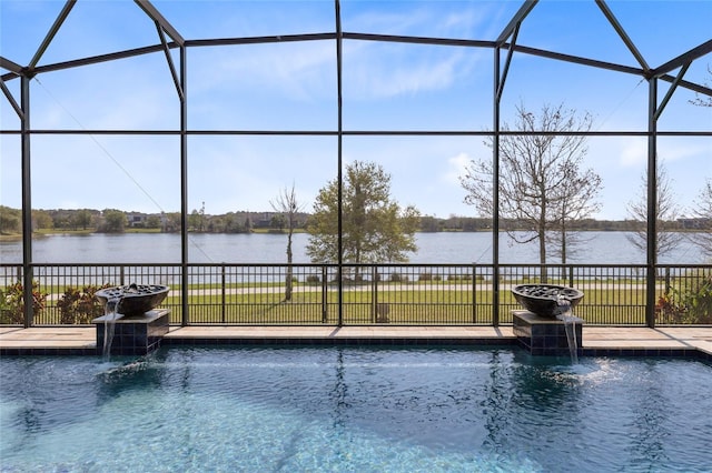 view of swimming pool featuring glass enclosure, a water view, and a fenced in pool