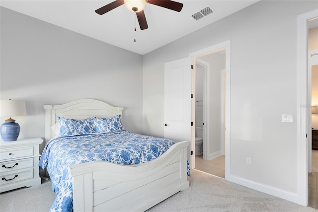 carpeted bedroom featuring a ceiling fan, baseboards, and visible vents