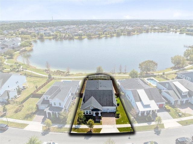 birds eye view of property with a residential view and a water view