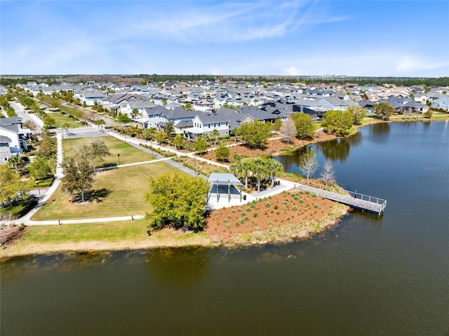 birds eye view of property featuring a residential view and a water view