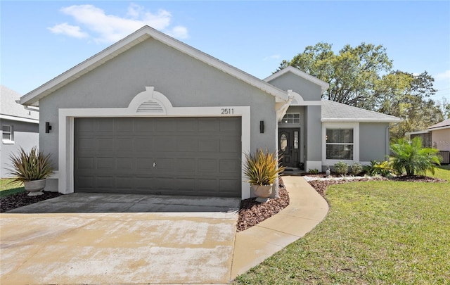 single story home featuring concrete driveway, a front lawn, a garage, and stucco siding