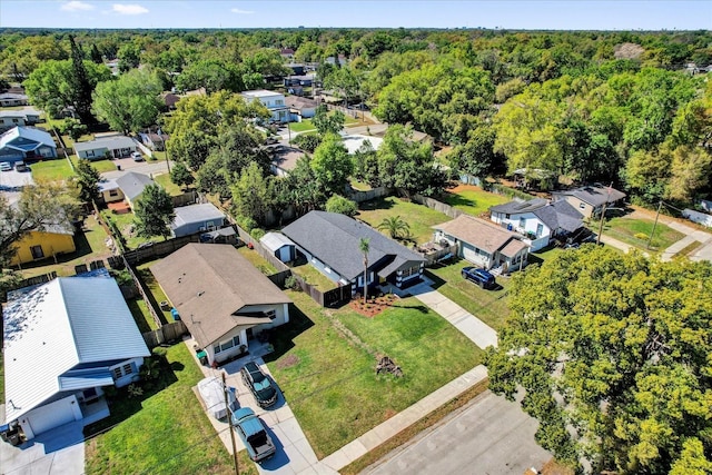 birds eye view of property with a forest view and a residential view