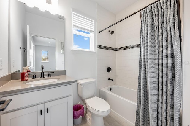 full bathroom with toilet, vanity, and shower / bathtub combination with curtain