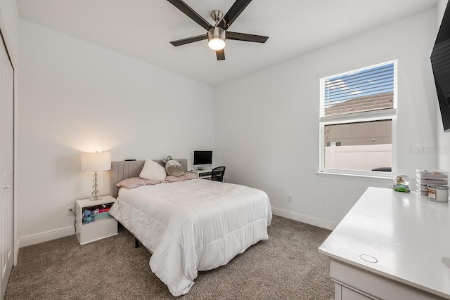 bedroom with baseboards, a ceiling fan, and carpet flooring