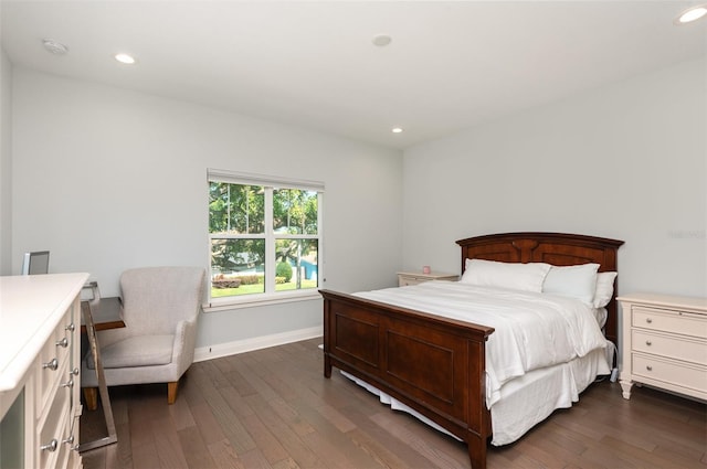 bedroom with recessed lighting, dark wood-style floors, and baseboards