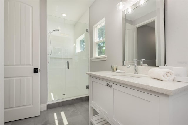 bathroom featuring vanity and a stall shower