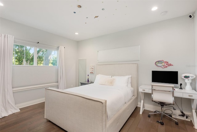 bedroom featuring recessed lighting, baseboards, and wood finished floors