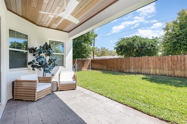 view of patio featuring a fenced backyard and ceiling fan